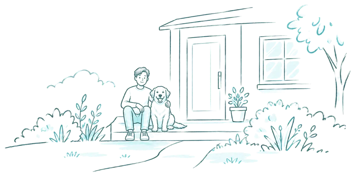 Man sitting on his front step with his dog